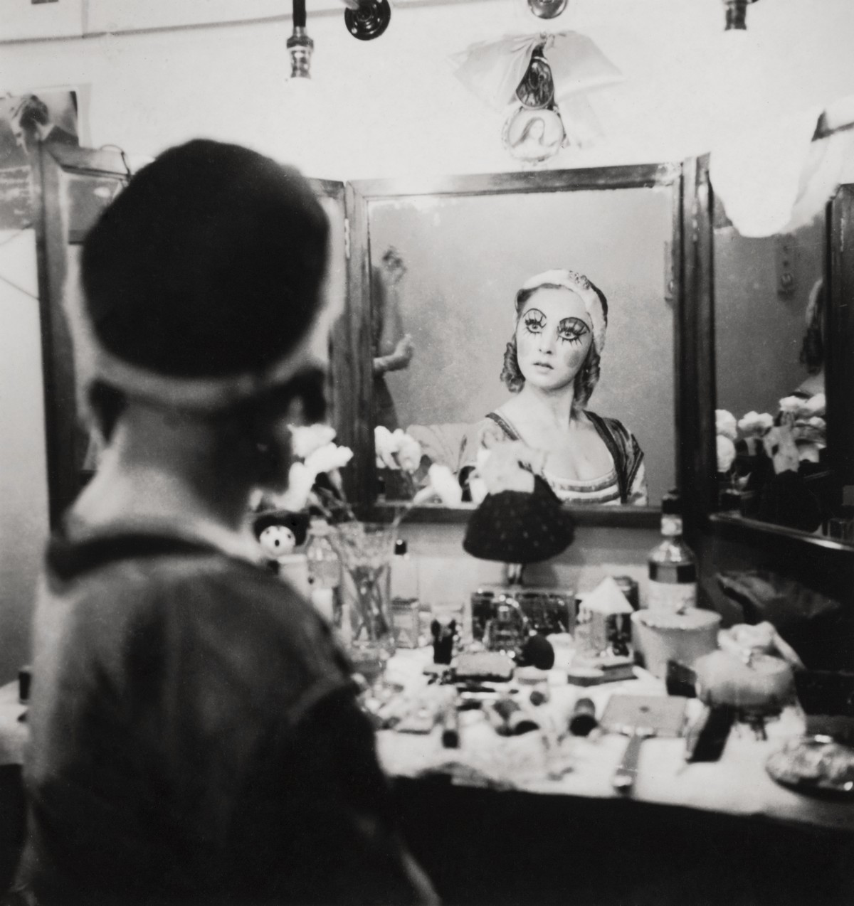 Baronova at dressing table in Petrouchka costume (1934)